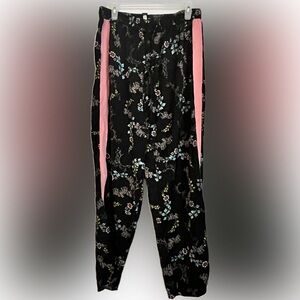 Black floral pants with pink grosgrain ribbon side stripe